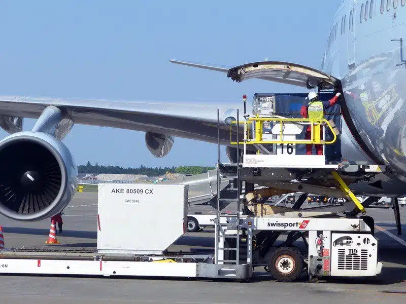 air freight loading onto plane air freight shipment of Texas Global Services' being loaded onto passenger aircraft