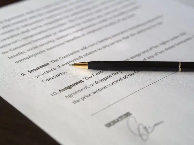 Legal papers or documentation and a pen close up, office setting
