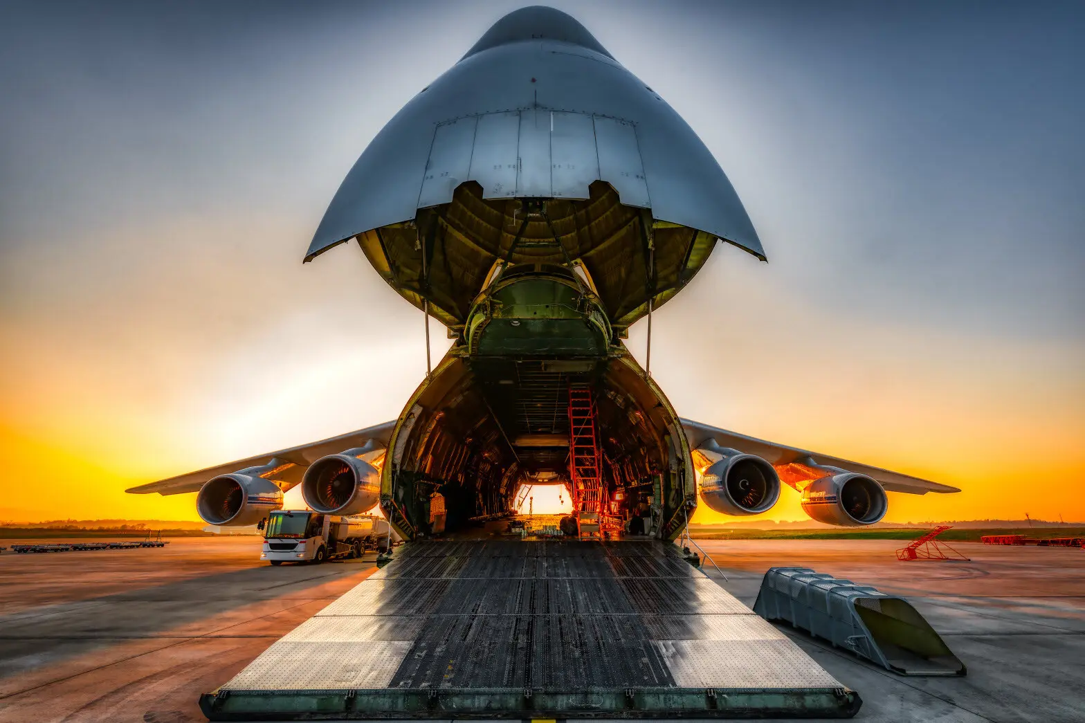 Nose loader cargo Aircraft open with sunset - Air Freight Forwarder