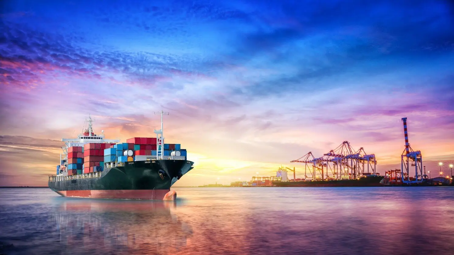 container ship with cranes sunset Texas Global Services - International Shipping - Ocean Freight Forwarder - Ocean freight shipping - Air Freight Forwarder - Expedited Air Freight