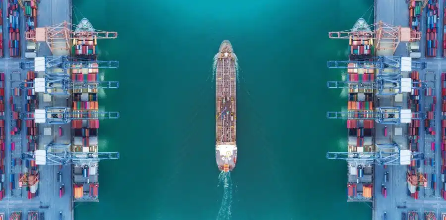 Container Ships being loaded on each side of port overhead view