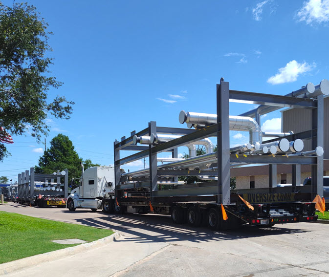 Chiller System components loaded on flatbed trailers