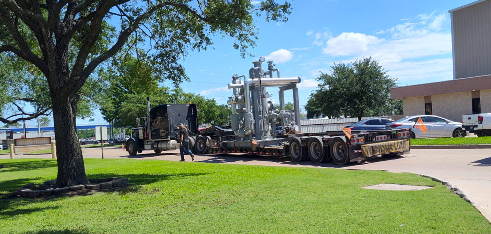 Chiller System being loaded onto Flatbed Trailer