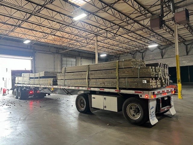 flat load Lumber loaded on a flatbed trailer ready to move