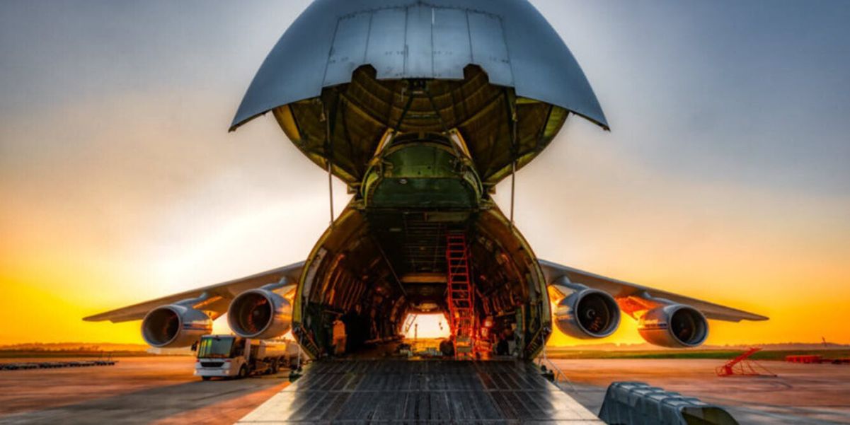 Noseloader cargo aircraft open in sunset - Air Freight