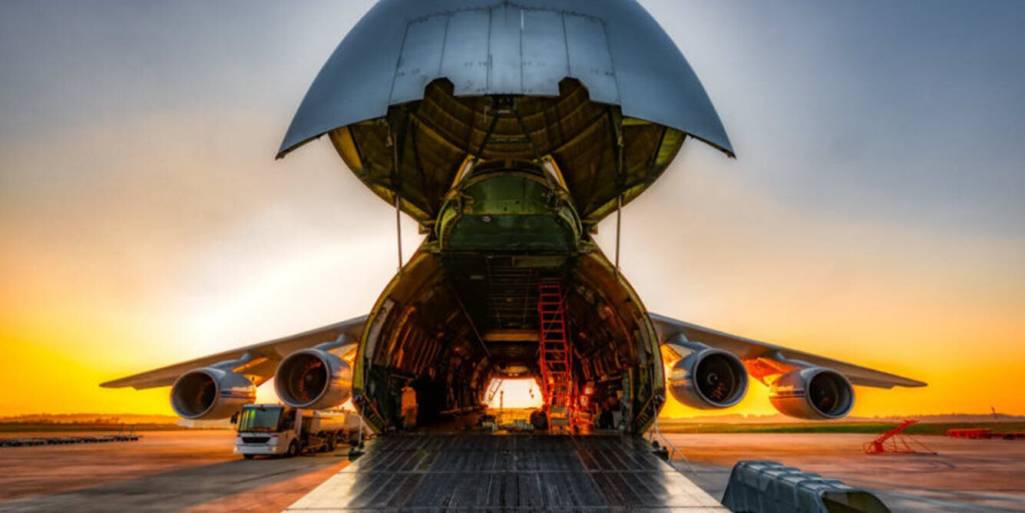 Noseloader cargo aircraft open in sunset - Air Freight